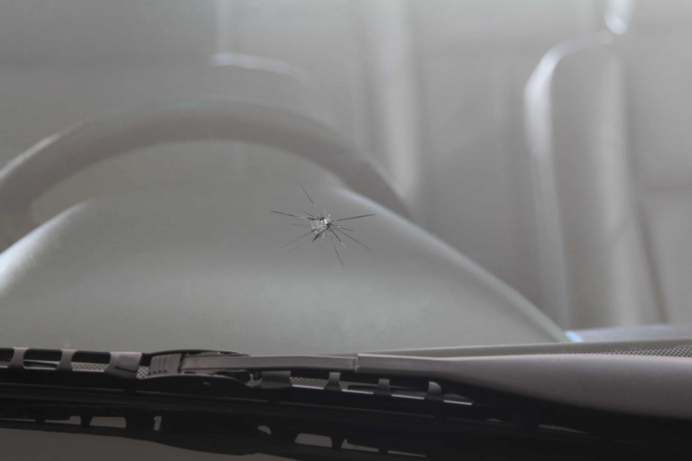 Car comes into auto glass shop for windshield repair after large crack continues to grow