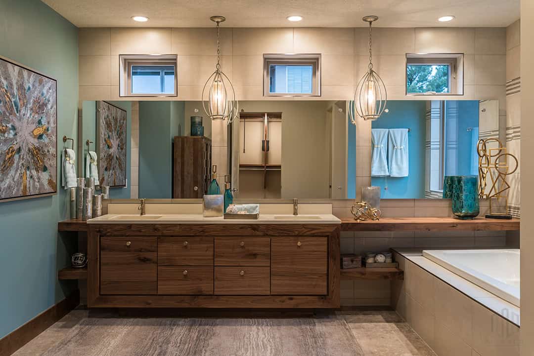 Beautiful large bathroom with big garden tub and long expansive vanity mirror