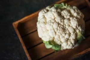 Cauliflower on wooden board, cleaned and ready for cooking